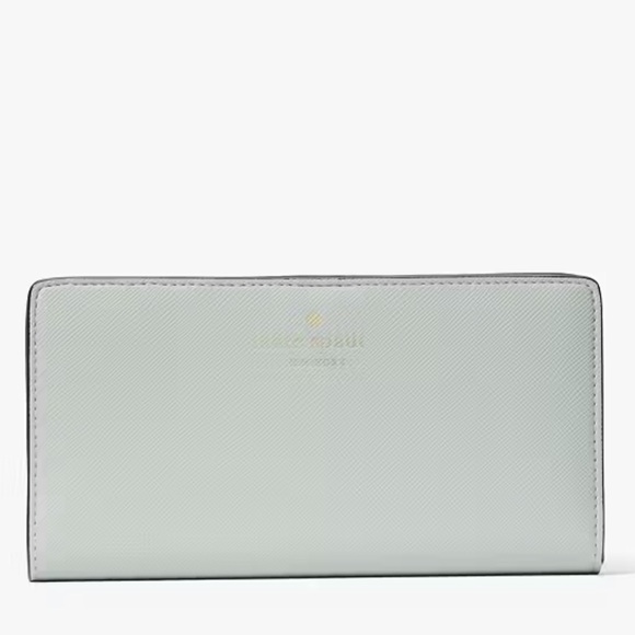 kate spade Handbags - NWT Kate Spade Crystal Blue Dana Large Slim Bifold Wallet